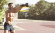 © Addoro - Crossfit training. Fitness man doing a weight training by lifting kettlebell. Midleaged athlete doing kettlebell swings. Bodybuilder lifting kettlebell. Crossfit instructor at the track.