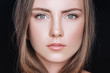 © LIGHTFIELD STUDIOS - portrait of attractive young woman with neutral makeup isolated on black
