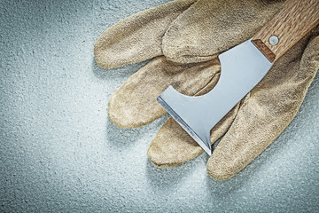 Plastering trowel protective gloves on concrete surface construc