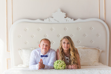 Wall Mural - Happy newlyweds near bride and groom