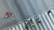 © ultramansk - the one man walk converse,  the busy city crowd move to pedestrian crosswalk on businees traffric road (Aerial photo, top view)