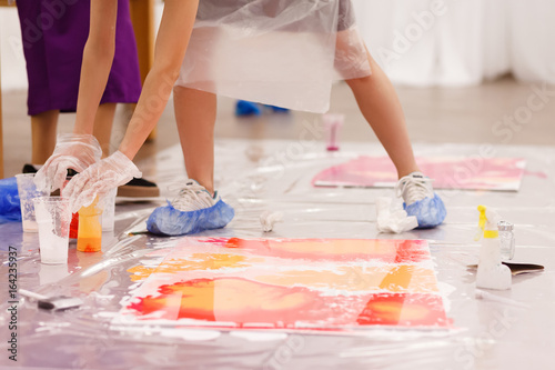 Cuadros en Lienzo Attractive group of mixed race diverse women artists bonding and unplugging with art therapy