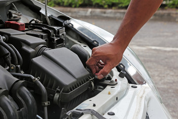 Human preparing and check the radiator of the car before departure for safety