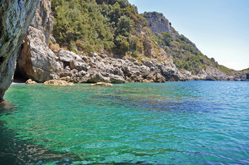 Wall Mural - The view from the Green grotto to the wild beach and emerald water