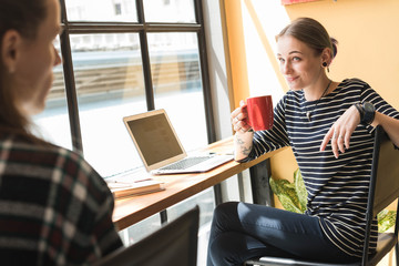 freelance working in coffee shop, Nomad worker conceptual, couple work together in cafe with laptop