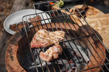 Roast pork steak on a charcoal stove.Steps to make a steak.