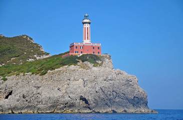 Wall Mural - A bright red lighthouse on the island of Capri