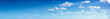 Leinwandbild Motiv Panorama of the blue sky with clouds
