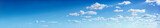 Fototapeta Na sufit - Panorama of the blue sky with clouds