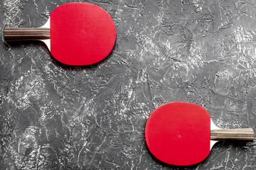 Wall Mural - Red racket for ping pong ball gray background top view