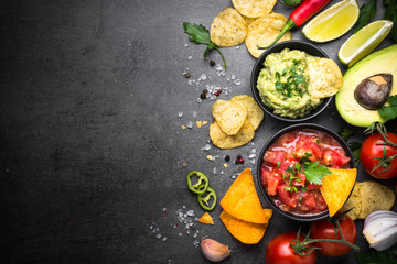Wall Mural - Latinamerican food party sauce guacamole, salsa, chips and ingre