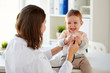 © Syda Productions - doctor with stethoscope and happy baby at clinic