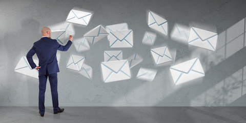 Wall Mural - Businessman using email interface on a wall 3D rendering