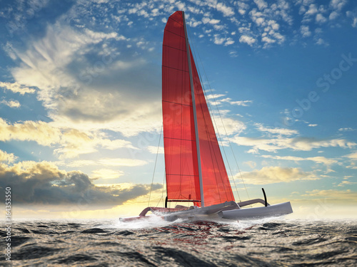 trimaran-z-czerwonym-zaglem-na-otwartym-morzu