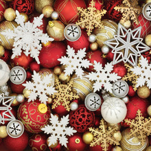 Christmas Bauble Decorations With White And Gold Snowflakes Forming An Abstract Background.
