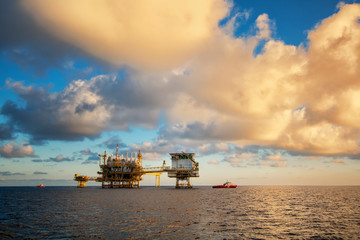 Wall Mural - Oil and gas platform landscape during sunset time