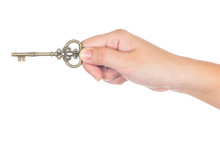 Woman's Hand Holding An Antique Key Isolated On White Background