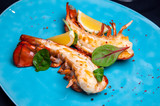 Fototapeta  - Lobster tail in maple-truffle sauce with lemon and basil