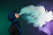 © Oleksandr - Vaping man and a cloud of vapor