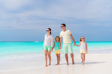 Young family on vacation on the beach. Family travel concept