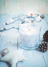 Christmas Background - Christmas Candle And Rustic Decoration On Wood Table With Christmas Lights Background In Night Party. Vintage Color Style.