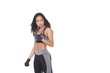 © Jade - Tan Skin Asian Fitness Girl in Gray Camouflage Sport Bra black spandex pants, stud gloves and sunglasses Exercise boxing warm up in white studio room,