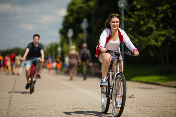 Wall Mural - Urban bicycle - teenage girl and boy cycling 