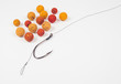 Carp hook boilies on the white background . CloseUp .