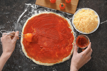 Sticker - Woman preparing pizza at kitchen table