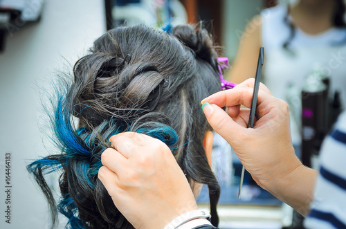 Closeup Of A Professional Hairdresser S Hands Doing A Hairstyle In