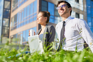 Sticker - Two colleagues having break outdoors on sunny day