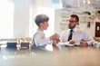 © pressmaster - Two entrepreneurs having dialogue about joint business in cafe