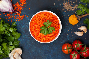 Wall Mural - red lentils in a white bowl