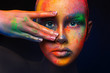 Model with colorful art make-up, close-up