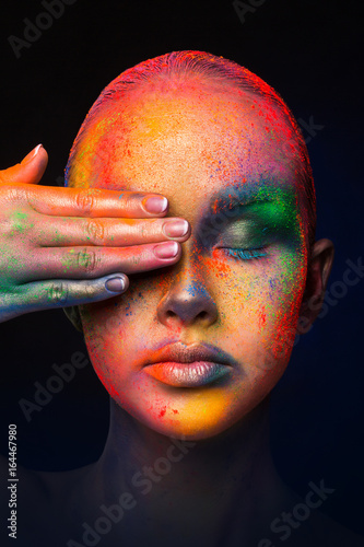 Model with colorful art make-up, close-up