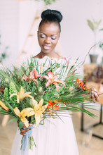Beautiful African American Bride With Tropical Bouquet In The Studio