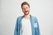 © Cookie Studio - Portrait of young handsome hipster man with beard smiling laughing looking at camera over white background.
