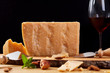 © sabuhinovruzov - Dutch goat cheese zwart on a wooden board. Cheese and red wine.