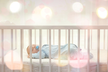 cute little baby sleeping in cradle at home