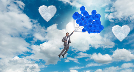 Wall Mural - Man flying balloons in romantic concept