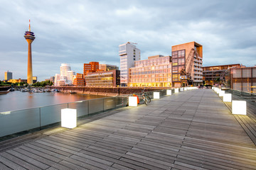 Wall Mural - Sunset view on the financial district with modern buildings and television tower in Dusseldorf city, Germany