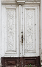 Old Wooden, Richly Decorated White Door