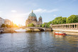 Sunrise view on the riverside with a National gallery building and cathedral in the old town of Berlin city