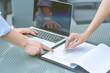 © Suntipong - Female hand signing contract, Human hands working with documents at the desk closeup, Two business partners signing a document, Selective focus.