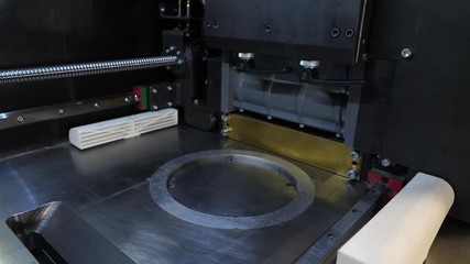 Wall Mural - Automatic three dimensional 3d printer performs product creation. Modern 3D printing or additive manufacturing and robotic automation technology