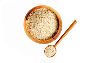 Oatmeal in wooden bowl and white background