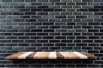 Wall Mural - Empty wood board shelf at black brick wall background,Mock up for display or montage of product or design