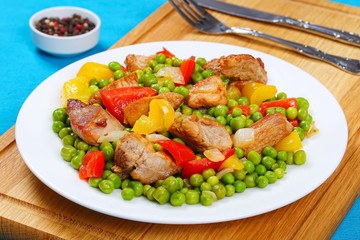 Poster - fried meat with green peas, onion, bell peppers