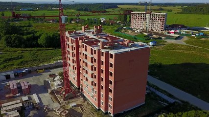 Wall Mural - Aerial view of multi-storey building construction at summer time