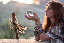Witch With Crystal Ball At Sunset